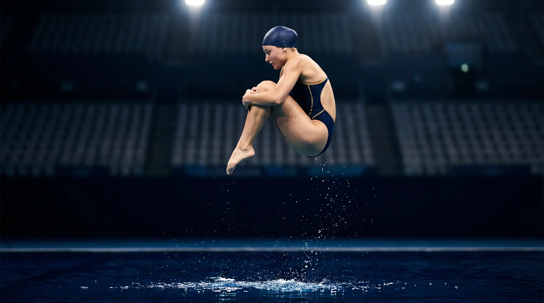 Competitive diver tucked in midair above a dark blue pool.